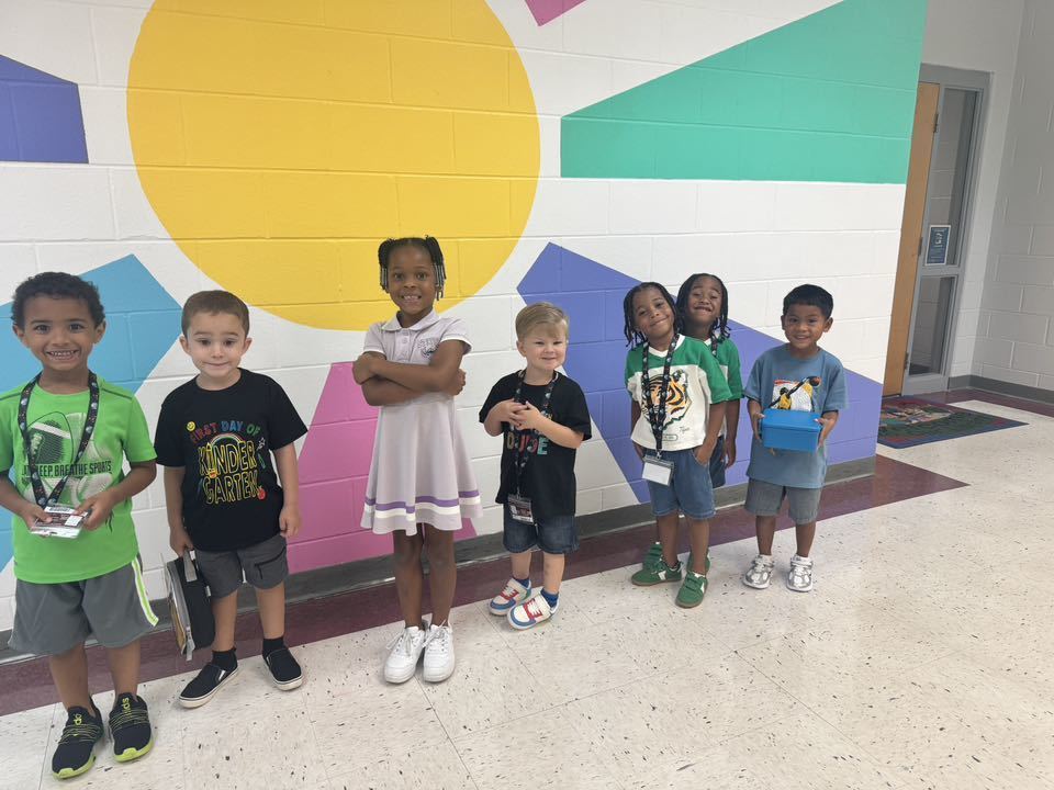 Kinder students excited in the hallway