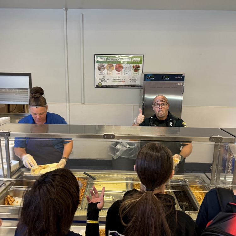 Deputy Hutton helping to serve lunch