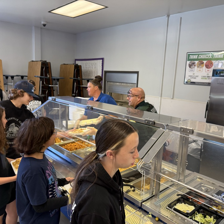 Deputy Hutton helping to serve lunch