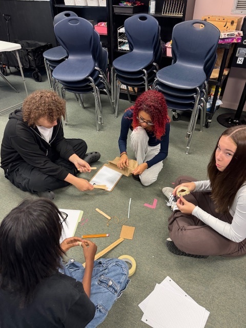 Ms. Wilson’s Theatre 1 students put their collaboration skills to the test with a tower-building competition! After being sorted into groups by personality type—lions, otters, beavers, and golden retrievers—each team worked to build the tallest and sturdiest tower using the same materials (plus one extra item of their choice). The tallest tower reached over 3 feet high!