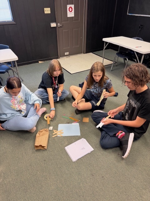 Ms. Wilson’s Theatre 1 students put their collaboration skills to the test with a tower-building competition! After being sorted into groups by personality type—lions, otters, beavers, and golden retrievers—each team worked to build the tallest and sturdiest tower using the same materials (plus one extra item of their choice). The tallest tower reached over 3 feet high!