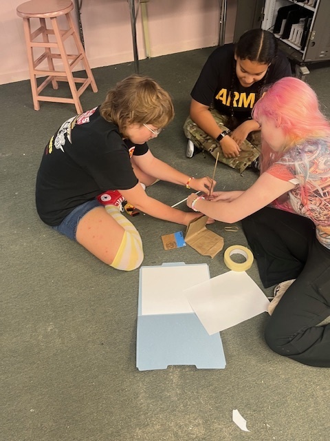 Ms. Wilson’s Theatre 1 students put their collaboration skills to the test with a tower-building competition! After being sorted into groups by personality type—lions, otters, beavers, and golden retrievers—each team worked to build the tallest and sturdiest tower using the same materials (plus one extra item of their choice). The tallest tower reached over 3 feet high!