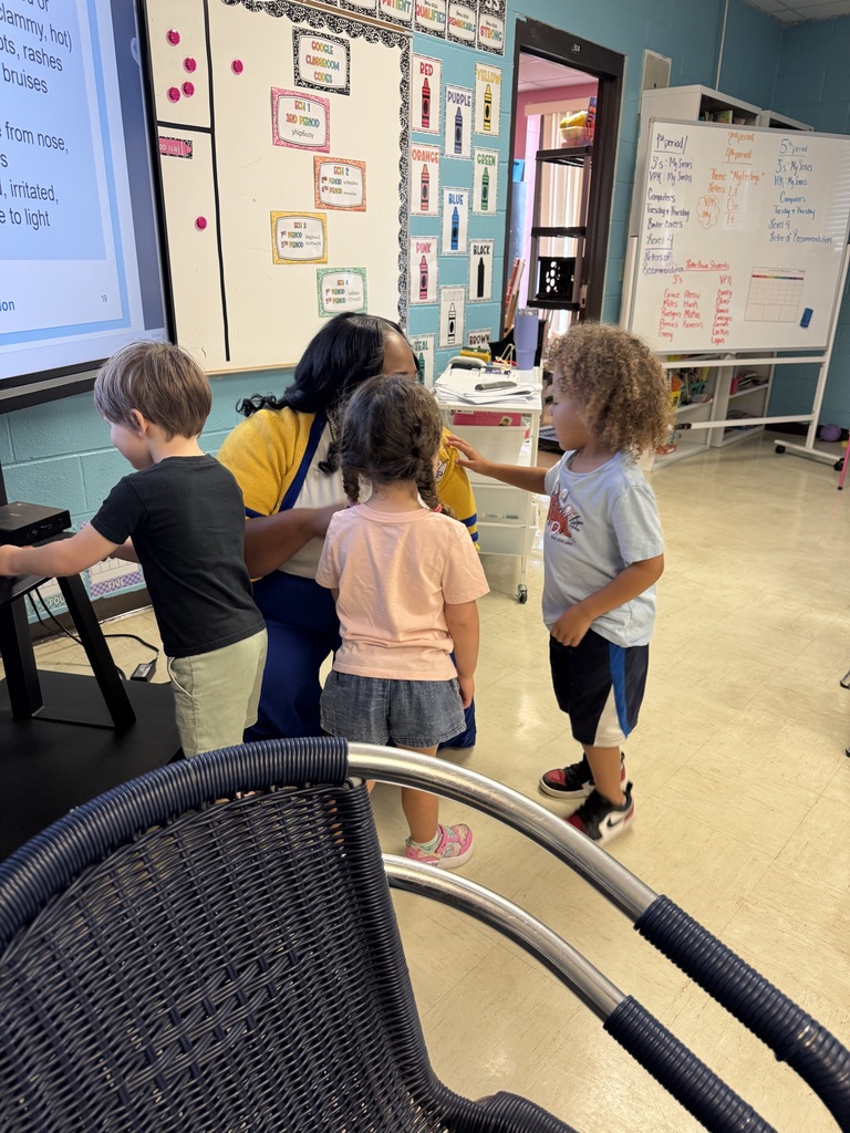 eacher Ms. Robinson guiding students through the Daily Health Check demonstration.