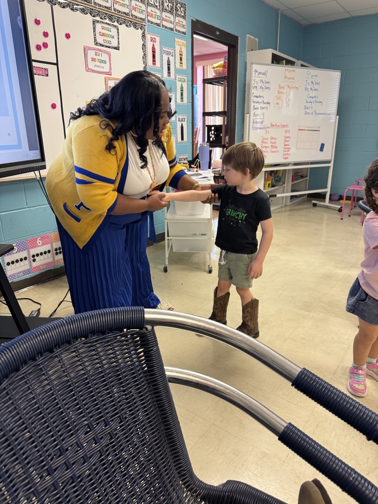 eacher Ms. Robinson guiding students through the Daily Health Check demonstration.