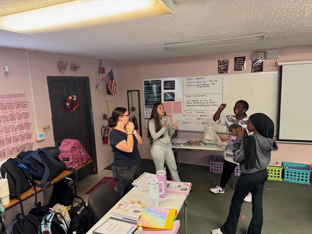 Theatre students spread out around the classroom, walking slowly while preparing to act out emotional prompts.