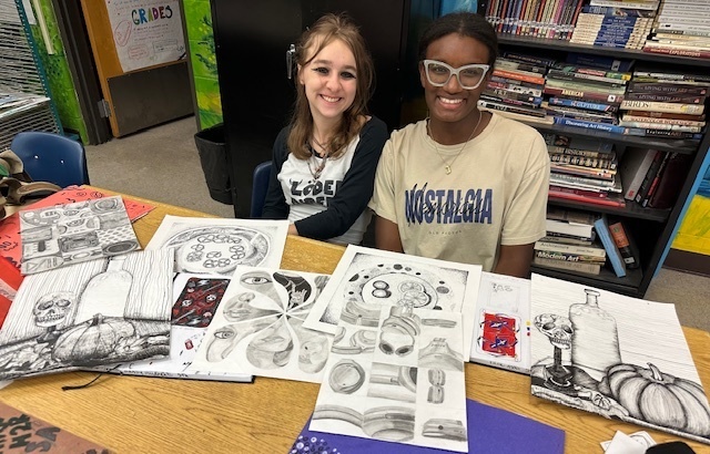 students showcasing their art