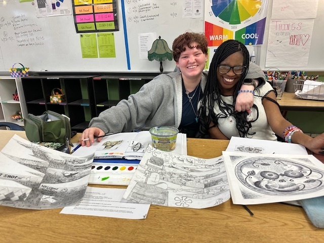 students showcasing their art