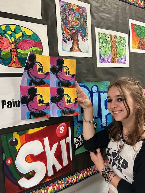 students showcasing their art