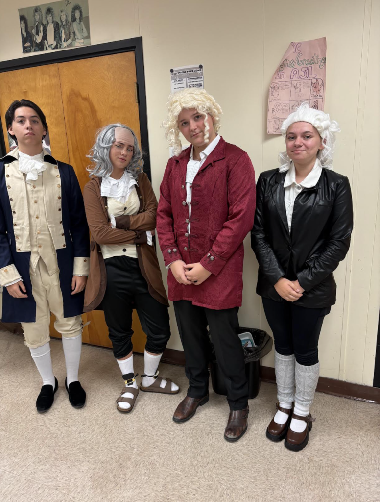 Four students dressed up as Founding Fathers