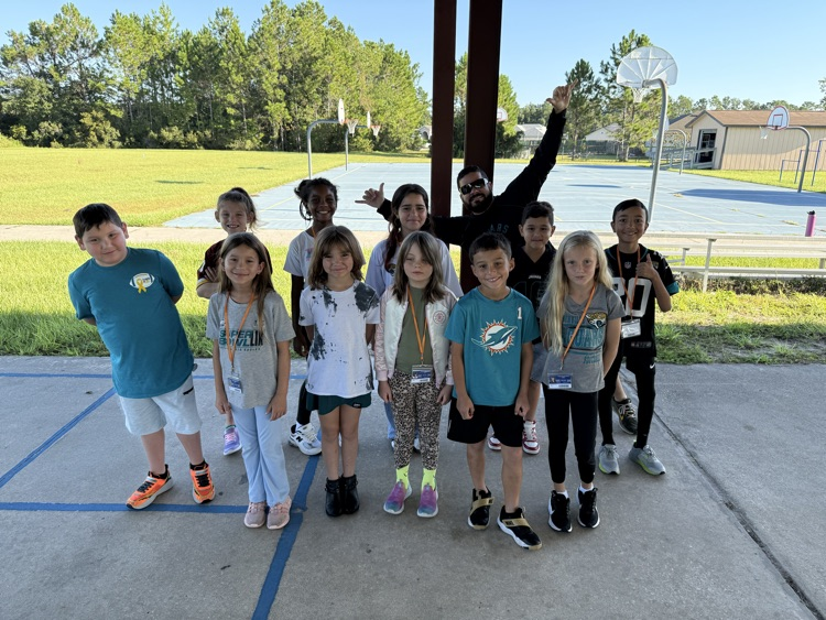 students dressed in NFL gear