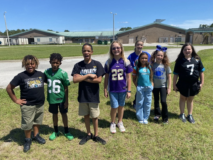 students dressed in NFL gear