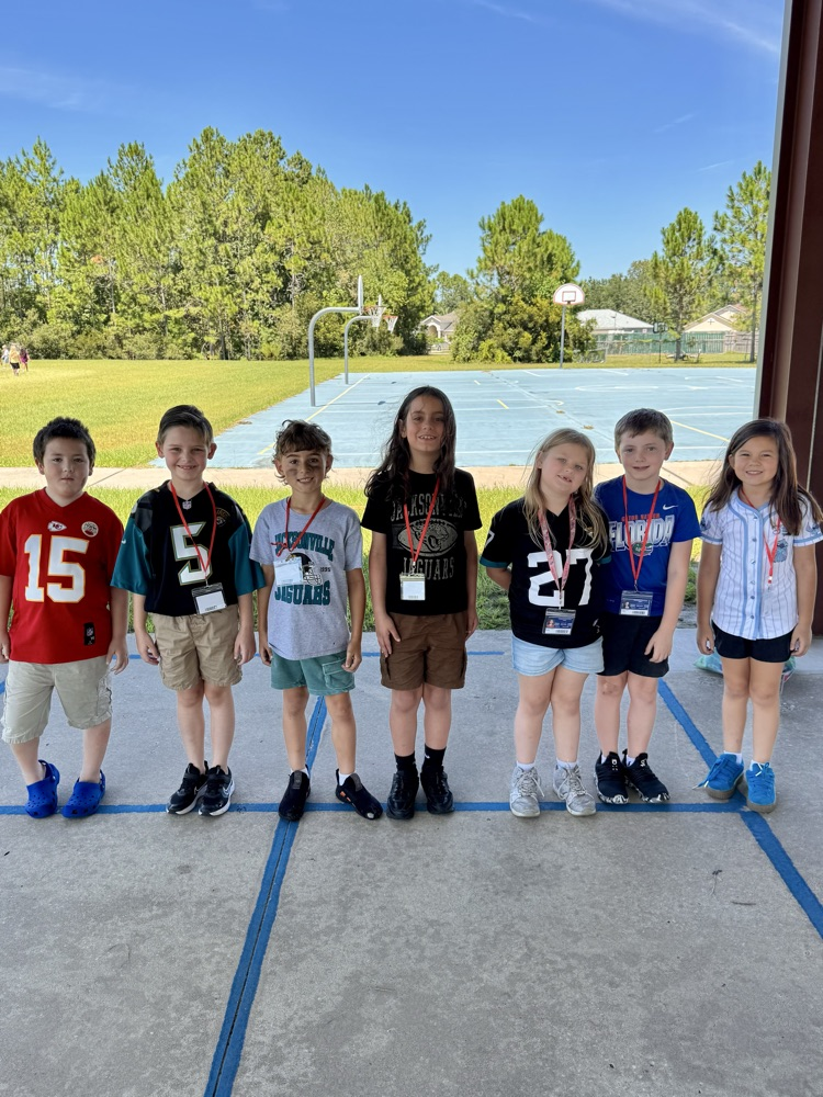 students dressed in NFL gear