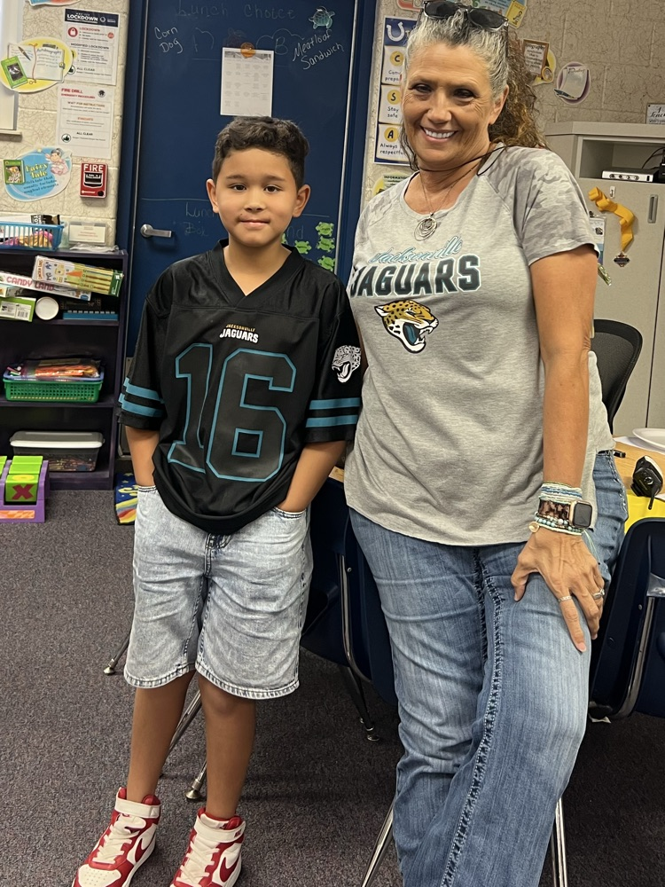 students dressed in NFL gear