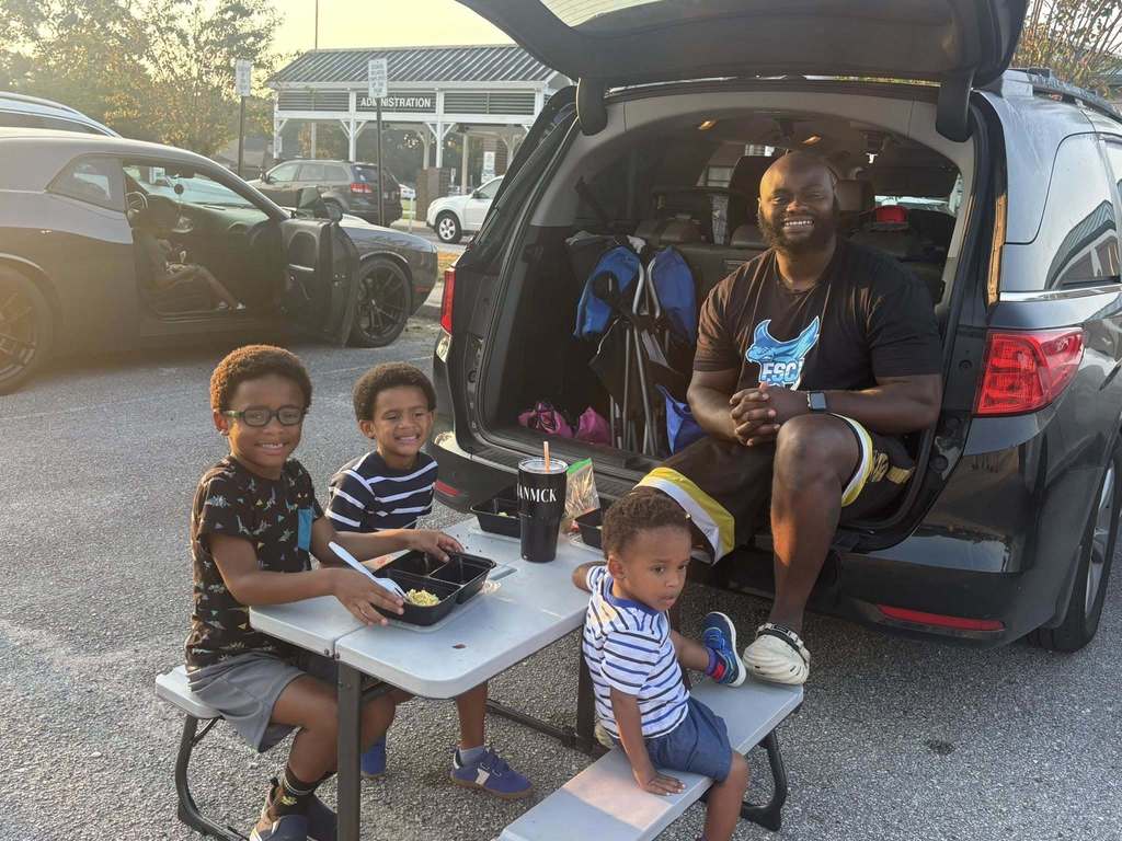 Dad tailgating with his sons