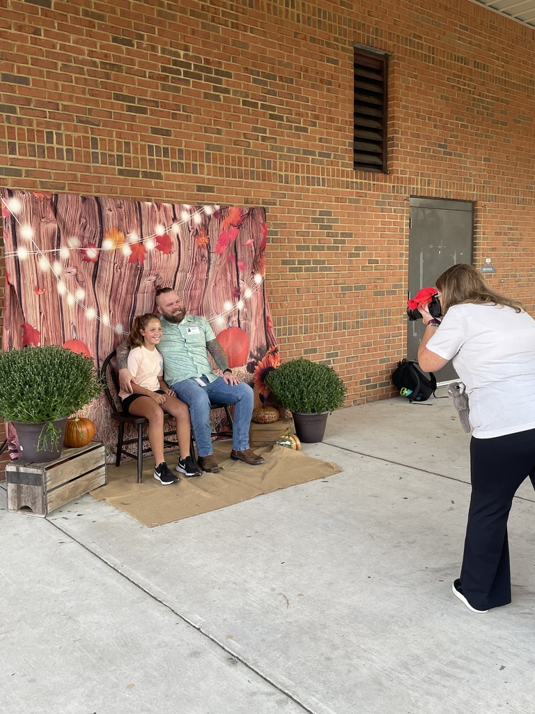 Dad with daughter at fall photo booth 