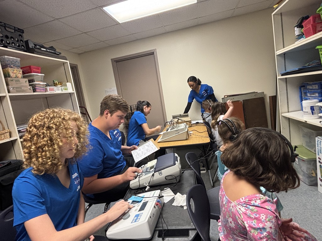 Health Science Foundations juniors recently brought classroom learning to life by conducting school health screenings at Lakeside Elementary. After studying essential skills such as measuring vision, hearing, height, and weight—and exploring key professional characteristics of healthcare workers—students applied their clinical training to perform basic screenings. This hands-on experience created a valuable connection between theoretical knowledge and real-world clinical practice, helping prepare our future healthcare professionals for their careers.