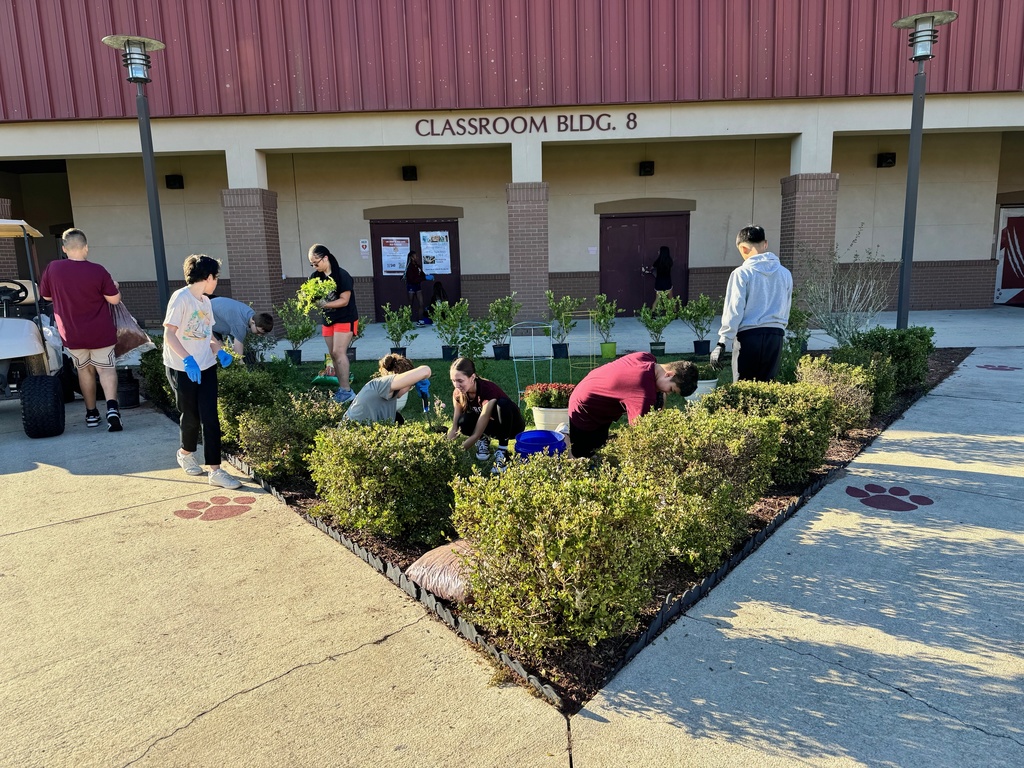 Students actively working in the garden plot at LAJH