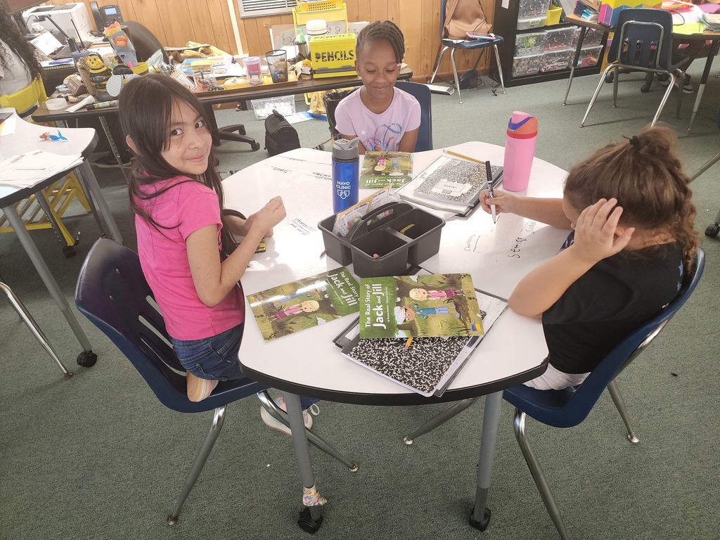 3 female students working on plot elements