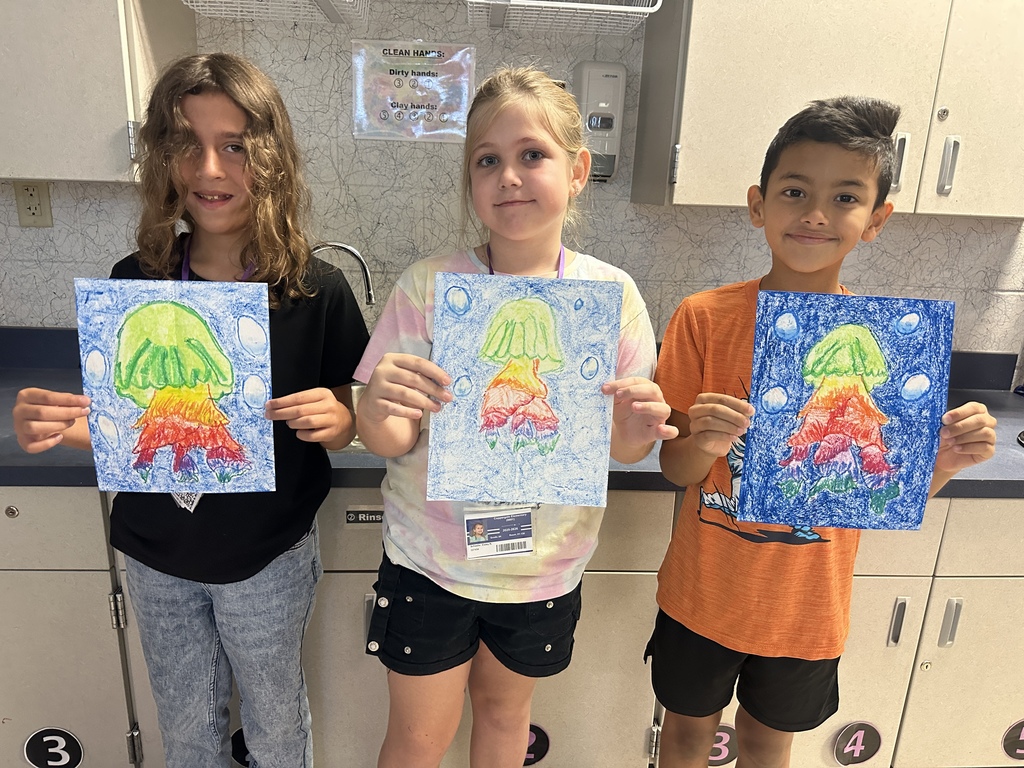 fourth grade students with jellyfish drawings