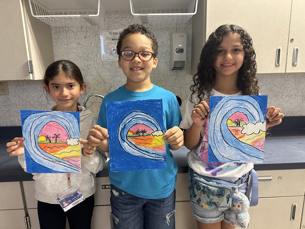 third grade students with wave drawings