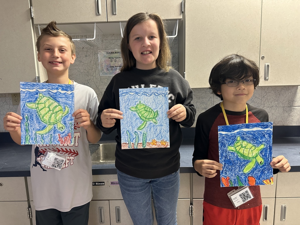 fifth grade students with turtle drawings