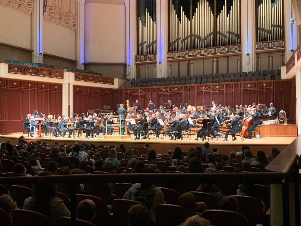 Our General Music students had the incredible opportunity to experience the Jacksonville Symphony last week! Held at the beautiful Jacoby Symphony Hall, the concert introduced students to the power and excitement of live symphonic music through the Symphony’s Preludes program — a lively, interactive performance designed for young audiences.  This 45-minute concert showcased all sections of the orchestra and connected beautifully to what students are learning in the classroom, helping them see (and hear!) how music tells stories, sparks imagination, and brings people together.  A special thank you to Ms. Bice, Ms. Manis, and peer mentor Alicia Quezada for accompanying our students and helping make this memorable musical experience possible!
