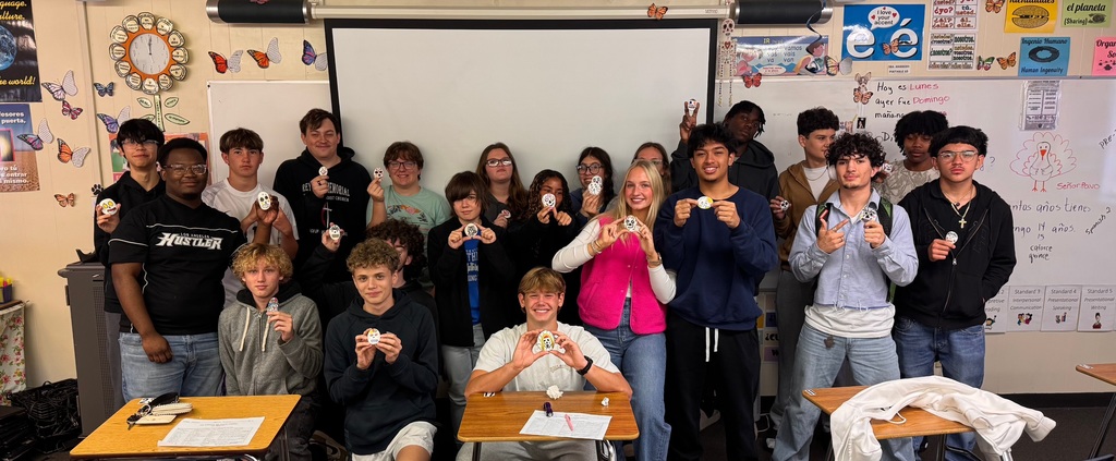 Students in Ms. Marrero’s Spanish 2 and AICE 2 classes celebrated Día de los Muertos by decorating remembrance stones dedicated to loved ones, pets, or admired figures who have passed away. As part of this cultural exploration, students expressed their emotions and described their creative process entirely in Spanish, using familiar vocabulary and new descriptive phrases. Through this experience, they deepened their language skills while connecting the rich traditions, symbols, and meanings of Día de los Muertos to their own lives.