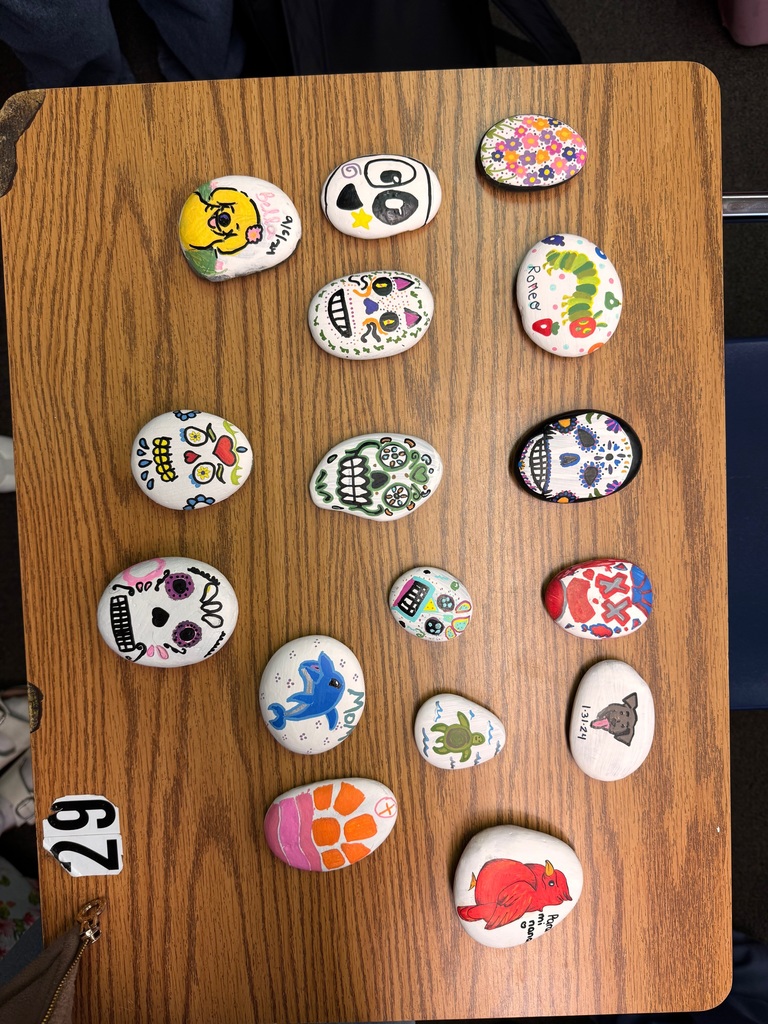 Students in Ms. Marrero’s Spanish 2 and AICE 2 classes celebrated Día de los Muertos by decorating remembrance stones dedicated to loved ones, pets, or admired figures who have passed away. As part of this cultural exploration, students expressed their emotions and described their creative process entirely in Spanish, using familiar vocabulary and new descriptive phrases. Through this experience, they deepened their language skills while connecting the rich traditions, symbols, and meanings of Día de los Muertos to their own lives.