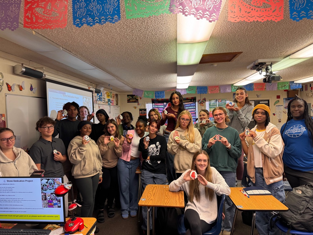 Students in Ms. Marrero’s Spanish 2 and AICE 2 classes celebrated Día de los Muertos by decorating remembrance stones dedicated to loved ones, pets, or admired figures who have passed away. As part of this cultural exploration, students expressed their emotions and described their creative process entirely in Spanish, using familiar vocabulary and new descriptive phrases. Through this experience, they deepened their language skills while connecting the rich traditions, symbols, and meanings of Día de los Muertos to their own lives.