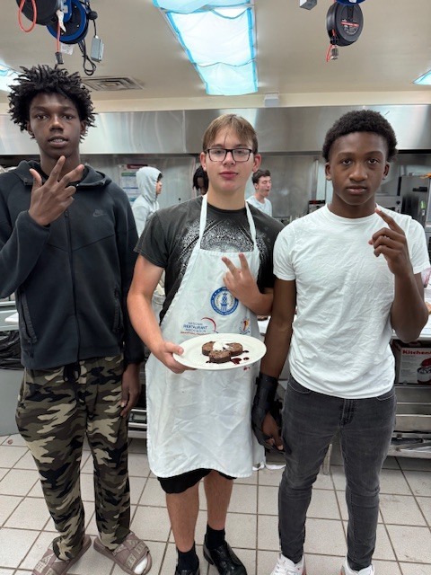 Ms. LaPierre’s Culinary 2 students are refining their plating and presentation skills, turning simple desserts into edible works of art! Students prepared rich brownies topped with a vibrant berry coulis, practicing precision, balance, and design to create visually stunning (and delicious!) plates. Their attention to detail and creativity truly showcase the artistry behind professional culinary presentation. 