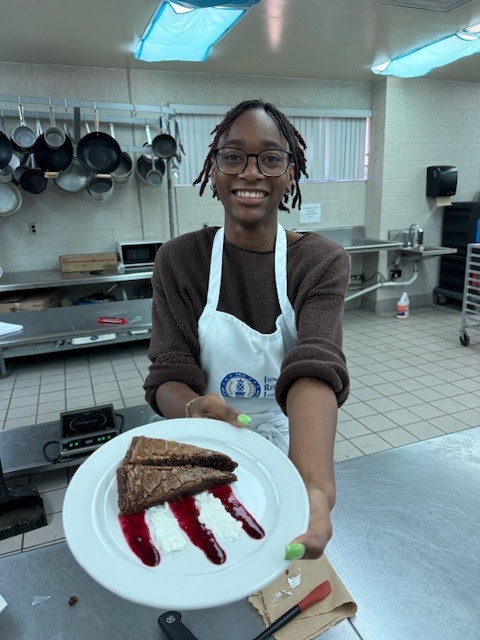 Ms. LaPierre’s Culinary 2 students are refining their plating and presentation skills, turning simple desserts into edible works of art! Students prepared rich brownies topped with a vibrant berry coulis, practicing precision, balance, and design to create visually stunning (and delicious!) plates. Their attention to detail and creativity truly showcase the artistry behind professional culinary presentation. 