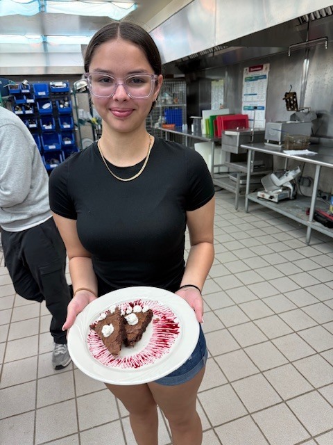 Ms. LaPierre’s Culinary 2 students are refining their plating and presentation skills, turning simple desserts into edible works of art! Students prepared rich brownies topped with a vibrant berry coulis, practicing precision, balance, and design to create visually stunning (and delicious!) plates. Their attention to detail and creativity truly showcase the artistry behind professional culinary presentation. 