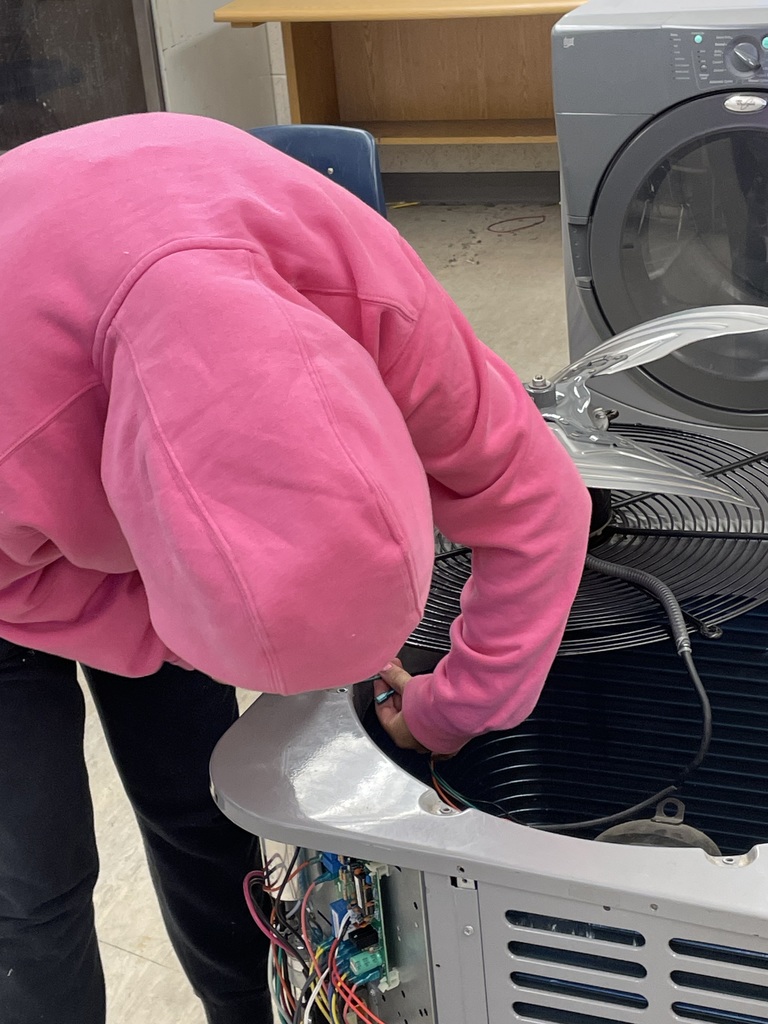 Freshman HVAC 1 student April F. is already gaining real-world experience as she works to disconnect the fan motor and remove it from the unit. This hands-on practice allows her to apply technical knowledge and build the skills needed for future success in the field!