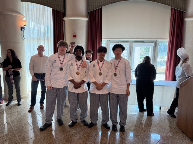 Chef LaPierre and Chef Stevens are extremely proud of our ProStart team for their outstanding performance at the Dayton State College Sharpen Your Skills Competition this past Friday. C.J., Gavin, Cole, and Ricky competed in the Gourmet Meal event, presenting an impressive menu that included ahi poke with homemade wonton chips, seared duck with miso sauce, bok choy, and a purple sweet potato espuma, followed by a tayiki filled with matcha pastry cream for dessert. Their hard work and creativity earned them an outstanding 2nd place finish!  Selia represented Ridgeview in the Decorative Food Centerpiece competition, while Yuri, Kendall, and Andreya showcased their skills in the Waiter Relay event. We are incredibly proud of all of our competitors and their dedication to excellence. We look forward to cheering them on again at the ProStart Competition in February!