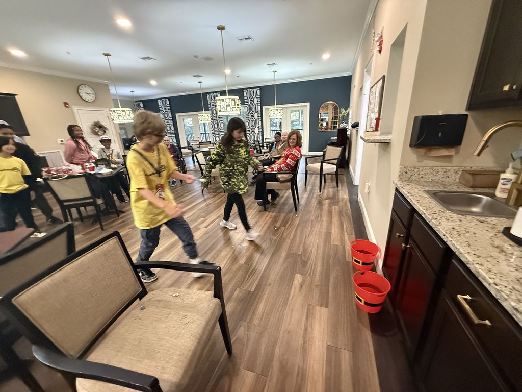 On December 15th, the Anchored 4 Life club provided a Christmas Party for the residents at Silver Treasures at Fleming Island. A lot of fun was had by all with refreshments, bingo, Minute to Win It games, and homemade cards. Thank you to the parents who came and helped also.