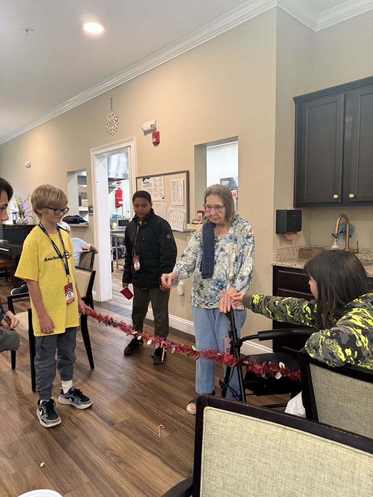 On December 15th, the Anchored 4 Life club provided a Christmas Party for the residents at Silver Treasures at Fleming Island. A lot of fun was had by all with refreshments, bingo, Minute to Win It games, and homemade cards. Thank you to the parents who came and helped also.