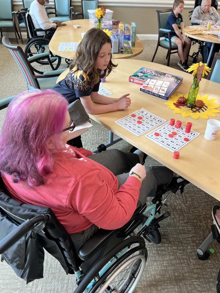 students playing bingo with residents