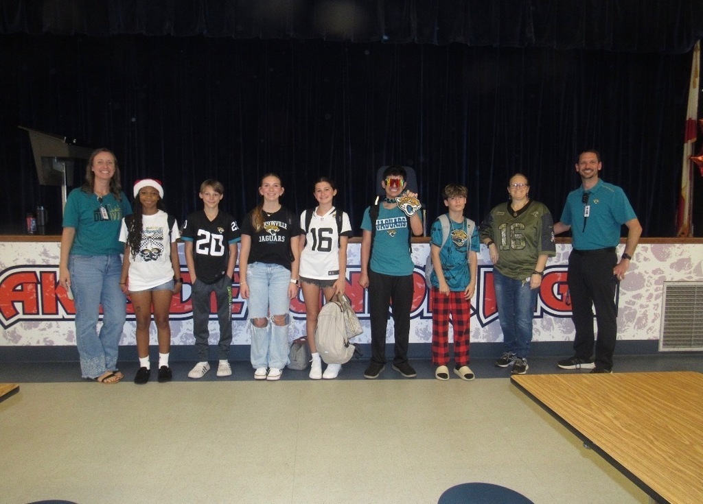 A group of students wearing jags gear