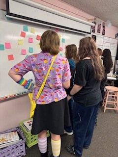 Ms. Wilson’s theatre students kicked off the new year by grounding themselves and setting meaningful intentions. This practice supports self-expression and character development in theatre while also strengthening essential life skills such as reflection, confidence, and personal growth. Students created both group and individual intentions, including writing a letter to their future selves to be opened on the last day of school—a powerful way to begin the year with purpose and vision.