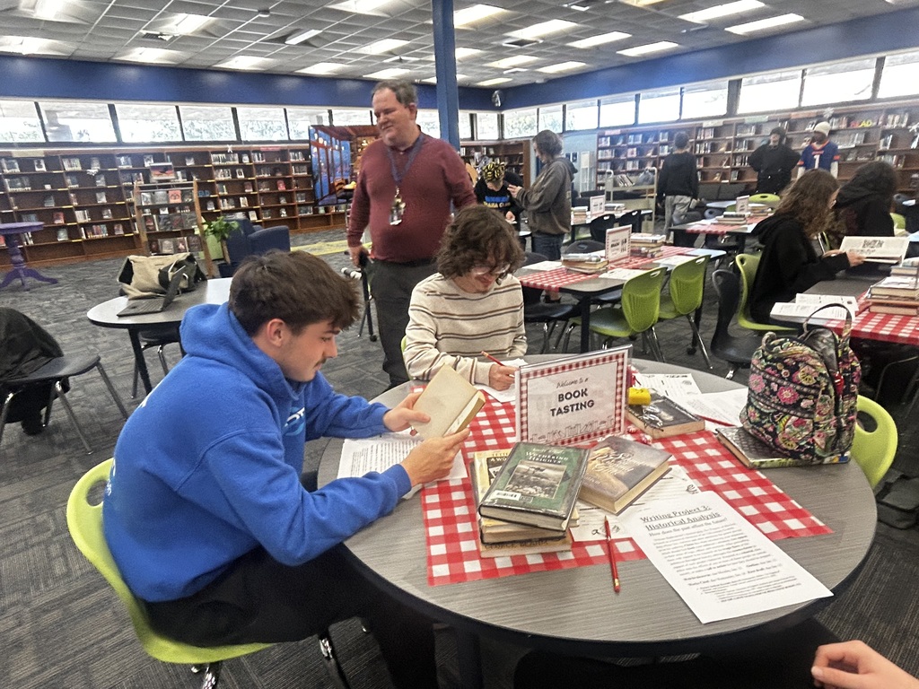 Our Media Specialist, Ms. Pittman, recently hosted an engaging Book Tasting experience for Mr. Werner’s 11th grade English students, transforming reading into an interactive and inviting event. Students rotated through thoughtfully curated tables, sampling a variety of genres and titles while reflecting on their interests and discovering new authors—much like choosing from a tasting menu. This creative approach encouraged student choice, curiosity, and meaningful conversations about reading, reinforcing a love of literacy in a fun and memorable way. Thank you to Ms. Pittman and Mr. Werner for partnering to create such a powerful and engaging learning experience for our students!