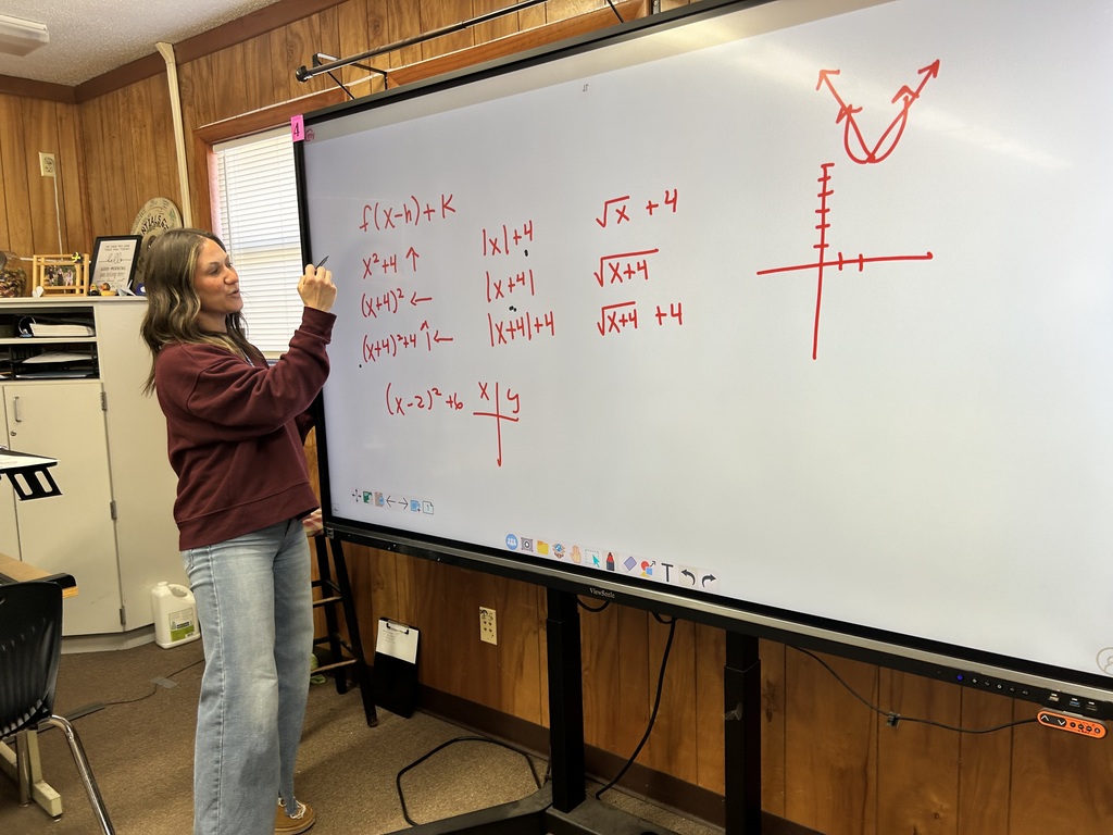 Ms. Charles’s Algebra II students were actively engaged in learning how to graph parabolas and quadratic equations, using strategies designed to help them efficiently tackle SAT-style questions. Through visual models and guided practice, students strengthened their understanding of how equations translate to graphs.  A highlight of the lesson was seeing a student step into a leadership role by explaining the math and reasoning behind the graphs to AP Williams, demonstrating both confidence and deep understanding.  Great examples of rigorous instruction, student ownership, and meaningful math discourse at Ridgeview! 🐾📐