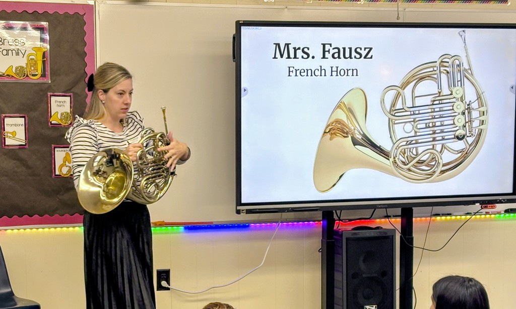 Mrs. Fausz visiting Music today!! 