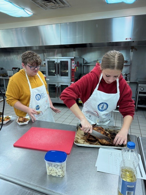 Ms. LaPierre’s Culinary 2 students turned the kitchen into a hands-on learning lab as they sharpened their roasting and sautéing skills. Students selected a roasted chicken recipe, expertly coated and prepped their chicken, and applied the same techniques to fresh vegetables for sautéing. As the kitchen filled with great aromas, students roasted their chicken and sautéed their vegetables to perfection. The experience concluded with students proudly enjoying the delicious meal they had created.