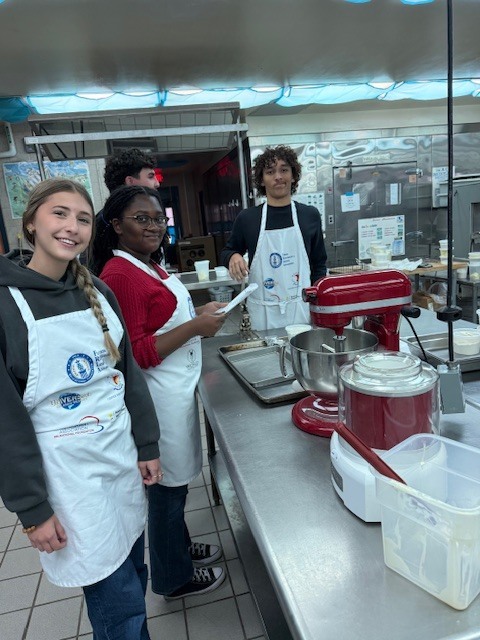 Culinary students in 3 and 4 took on a sweet, multi-day project, crafting homemade ice cream sandwiches from start to finish. On day one, students prepared their ice cream base and mise-en-place for their cookies. Day two focused on churning the ice cream, freezing it on sheet pans, and baking fresh cookies. On the final day, students used cookie cutters to shape the ice cream, assembled their sandwiches, and finished them off with a chocolate dip, bringing creativity, precision, and delicious results together.