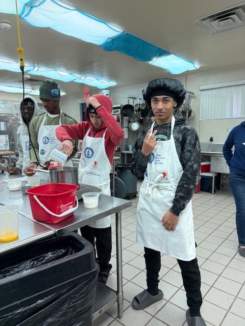 Culinary students in 3 and 4 took on a sweet, multi-day project, crafting homemade ice cream sandwiches from start to finish. On day one, students prepared their ice cream base and mise-en-place for their cookies. Day two focused on churning the ice cream, freezing it on sheet pans, and baking fresh cookies. On the final day, students used cookie cutters to shape the ice cream, assembled their sandwiches, and finished them off with a chocolate dip, bringing creativity, precision, and delicious results together.