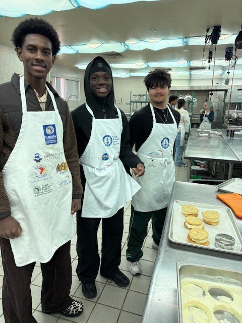 Culinary students in 3 and 4 took on a sweet, multi-day project, crafting homemade ice cream sandwiches from start to finish. On day one, students prepared their ice cream base and mise-en-place for their cookies. Day two focused on churning the ice cream, freezing it on sheet pans, and baking fresh cookies. On the final day, students used cookie cutters to shape the ice cream, assembled their sandwiches, and finished them off with a chocolate dip, bringing creativity, precision, and delicious results together.