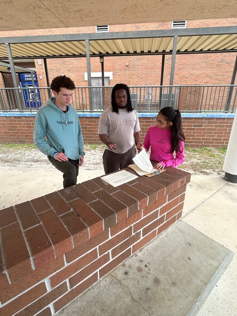 Mr. Ley’s IB Digital Society students took their learning to the courtyard as they worked collaboratively to analyze real-world ethical issues connected to Information Technology in preparation for their IB Digital Society exam. Students discussed how economic factors such as externalities, tariffs, trade-offs, net neutrality, and digital graveyards influence network decisions and their broader impact on society. Through discussion, debate, and problem-solving, students connected new concepts to prior learning, demonstrating their ability to think critically and apply knowledge across disciplines.