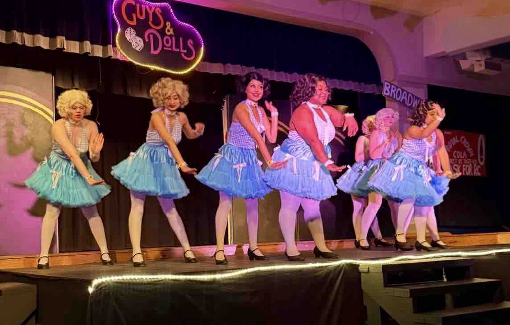 We are incredibly proud of the talented students who brought our production of Guys and Dolls to life! With over 100 students from our theater, chorus, and band programs involved, this production was truly a Panther collaboration. From acting and singing to stage management, set design, lighting, costumes, and live music, our students led every aspect of the show and demonstrated incredible dedication, creativity, and teamwork.  A very special thank you goes to Ms. McDade and Ms. Wilson for their leadership and tireless work guiding our theater students throughout the production. We are also grateful to Ms. Bice, who led our outstanding live orchestra, adding another level of energy and professionalism to the performance.  Productions like this showcase the remarkable talent and passion of our students and highlight the strength of our performing arts programs at Ridgeview. Congratulations to everyone involved on a fantastic show!