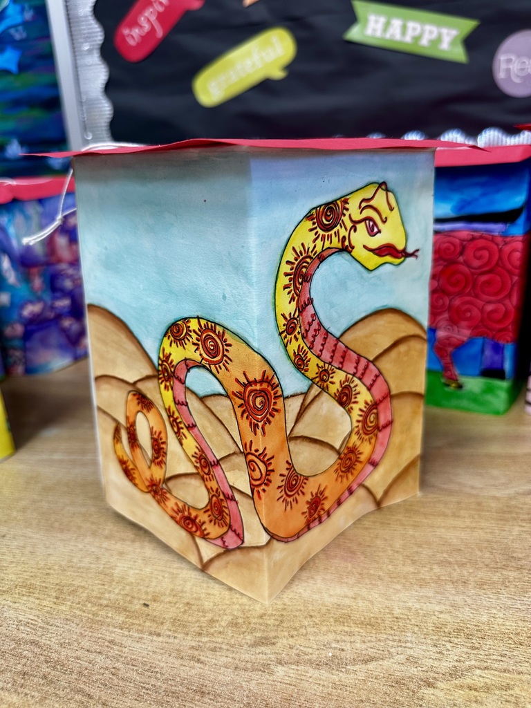 Ms. Generazio’s Art 2 students recently explored the traditions of the Chinese New Year while creating beautiful lantern projects inspired by the celebration. After learning about the cultural significance and symbolism of lanterns, students designed their own using watercolor and marker to bring their ideas to life.  The finished pieces showcase vibrant colors, detailed line work, and creative designs—from powerful tigers to beautifully patterned snakes and floral elements. By combining watercolor techniques with marker illustration, students were able to add depth, contrast, and intricate detail to their artwork.  Projects like this allow students to strengthen their artistic skills while also learning about traditions from around the world.