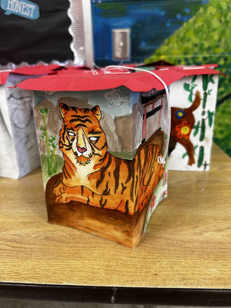 Ms. Generazio’s Art 2 students recently explored the traditions of the Chinese New Year while creating beautiful lantern projects inspired by the celebration. After learning about the cultural significance and symbolism of lanterns, students designed their own using watercolor and marker to bring their ideas to life.  The finished pieces showcase vibrant colors, detailed line work, and creative designs—from powerful tigers to beautifully patterned snakes and floral elements. By combining watercolor techniques with marker illustration, students were able to add depth, contrast, and intricate detail to their artwork.  Projects like this allow students to strengthen their artistic skills while also learning about traditions from around the world.